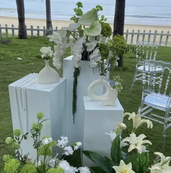 white plinths in multiple heights for wedding decor